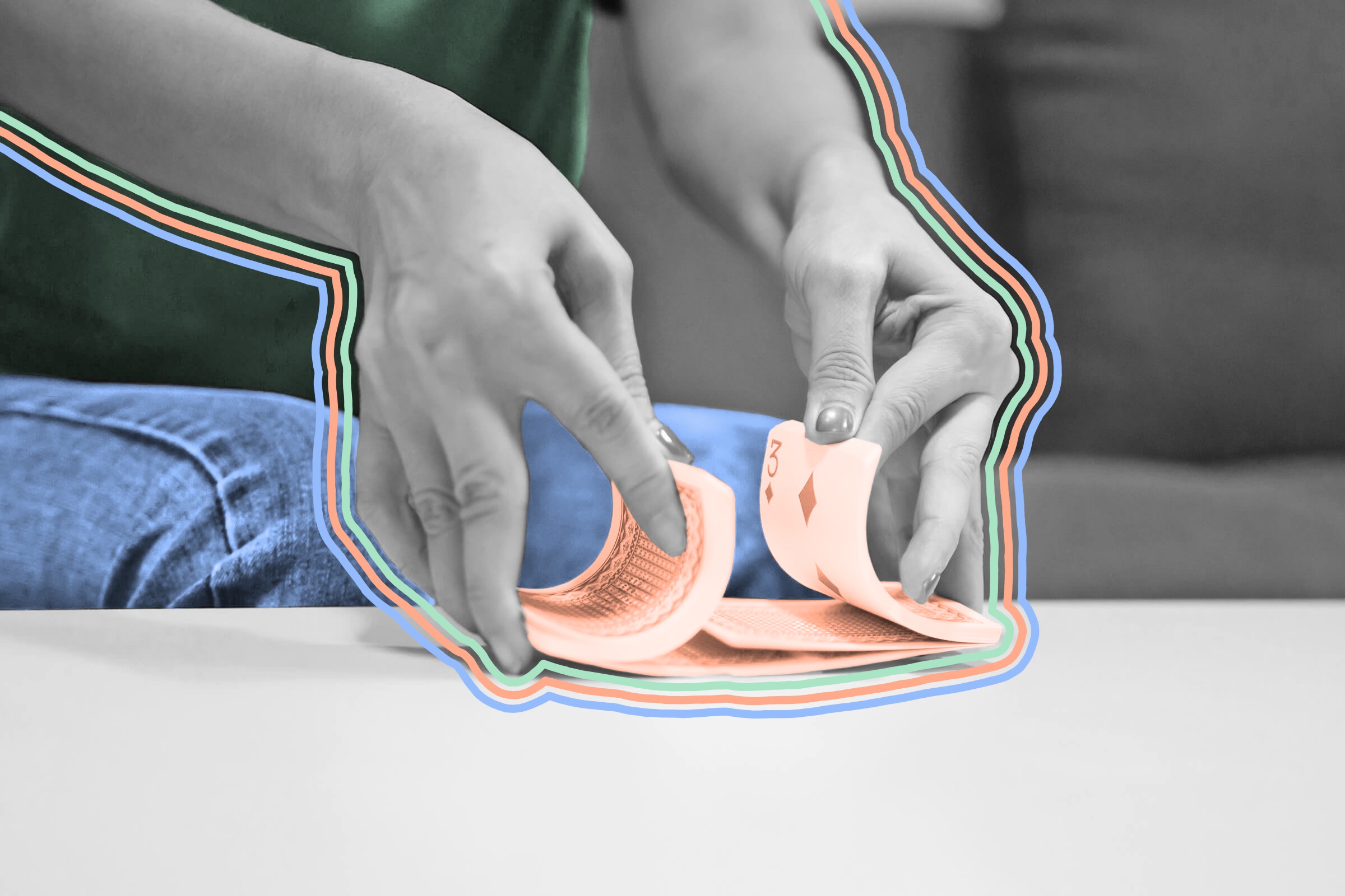 A woman shuffling a deck of playing cards