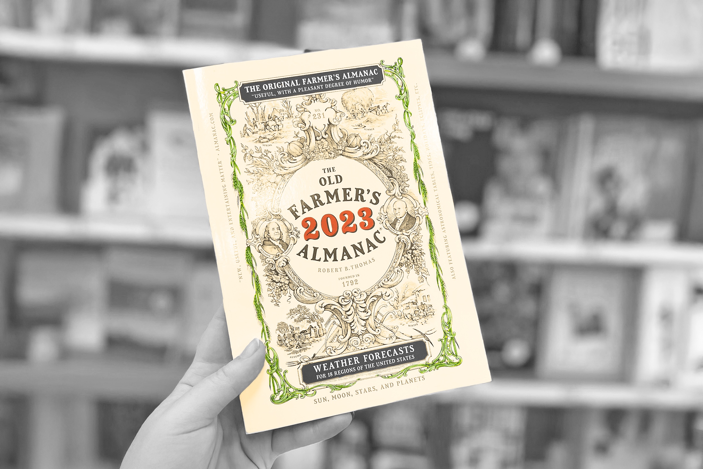 Hand holding a 2023 copy of The Old Farmer's Almanac