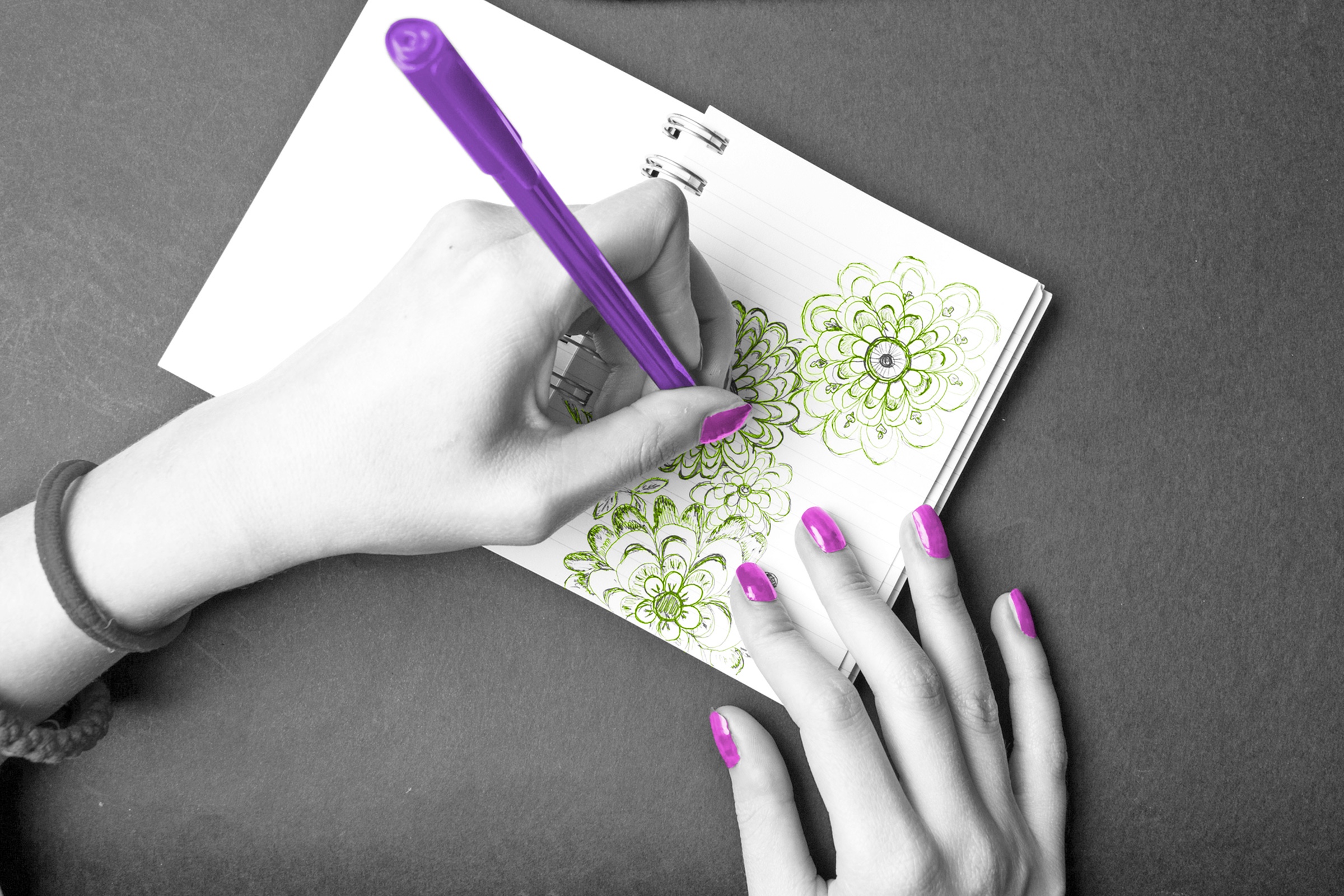 Woman doodling with her left hand