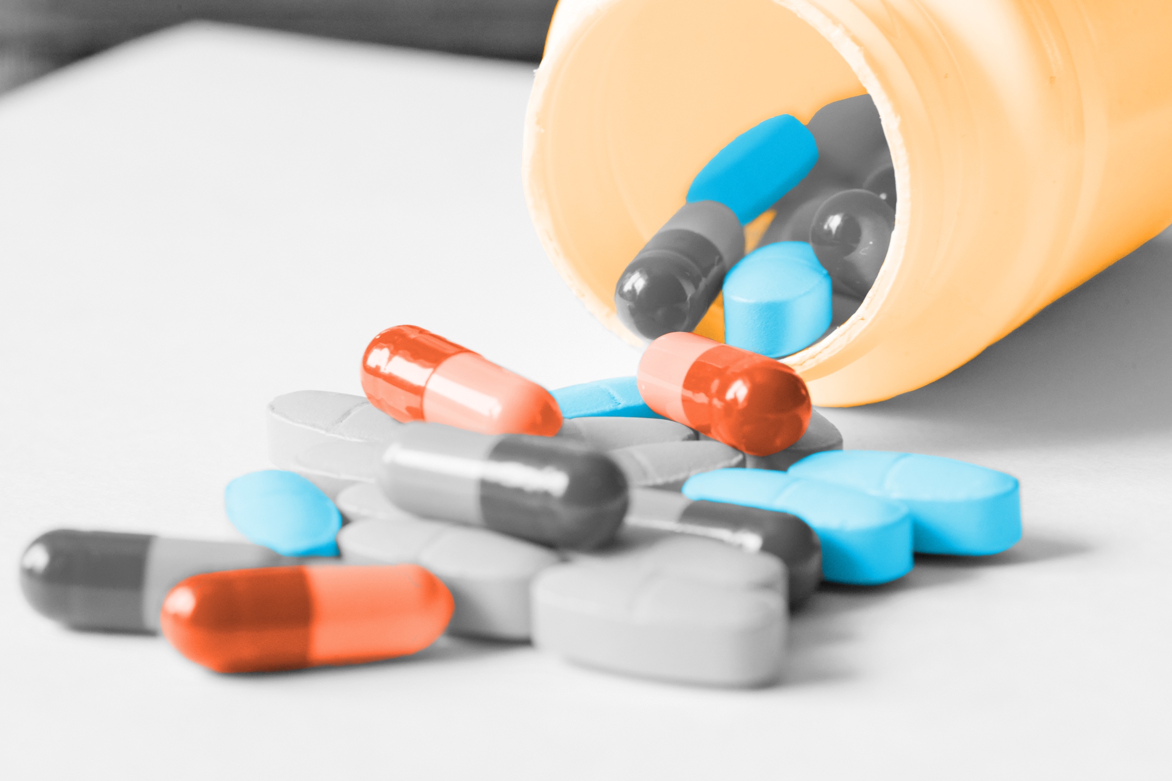 Pills spilling out of a pill bottle