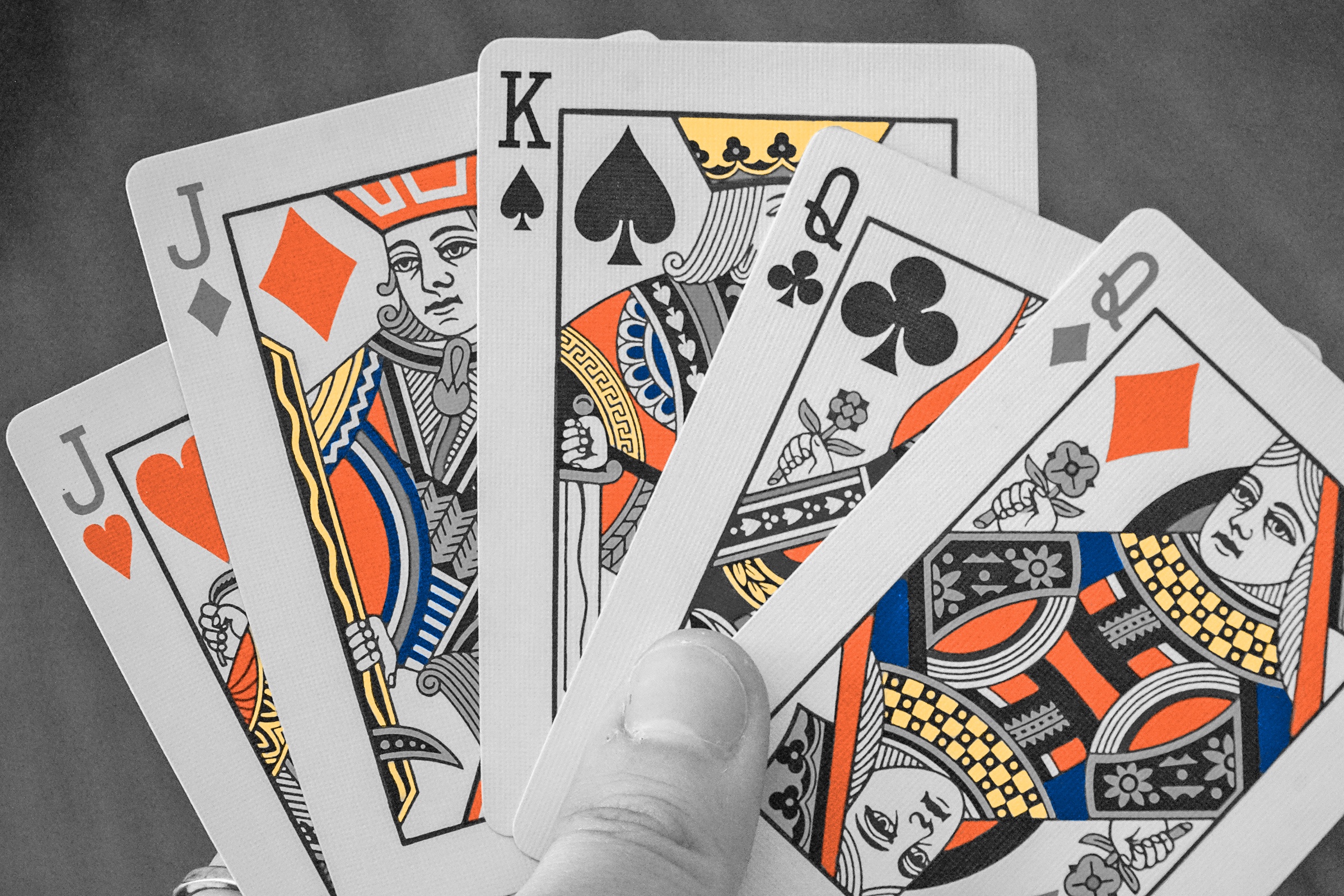 Hand holding playing cards