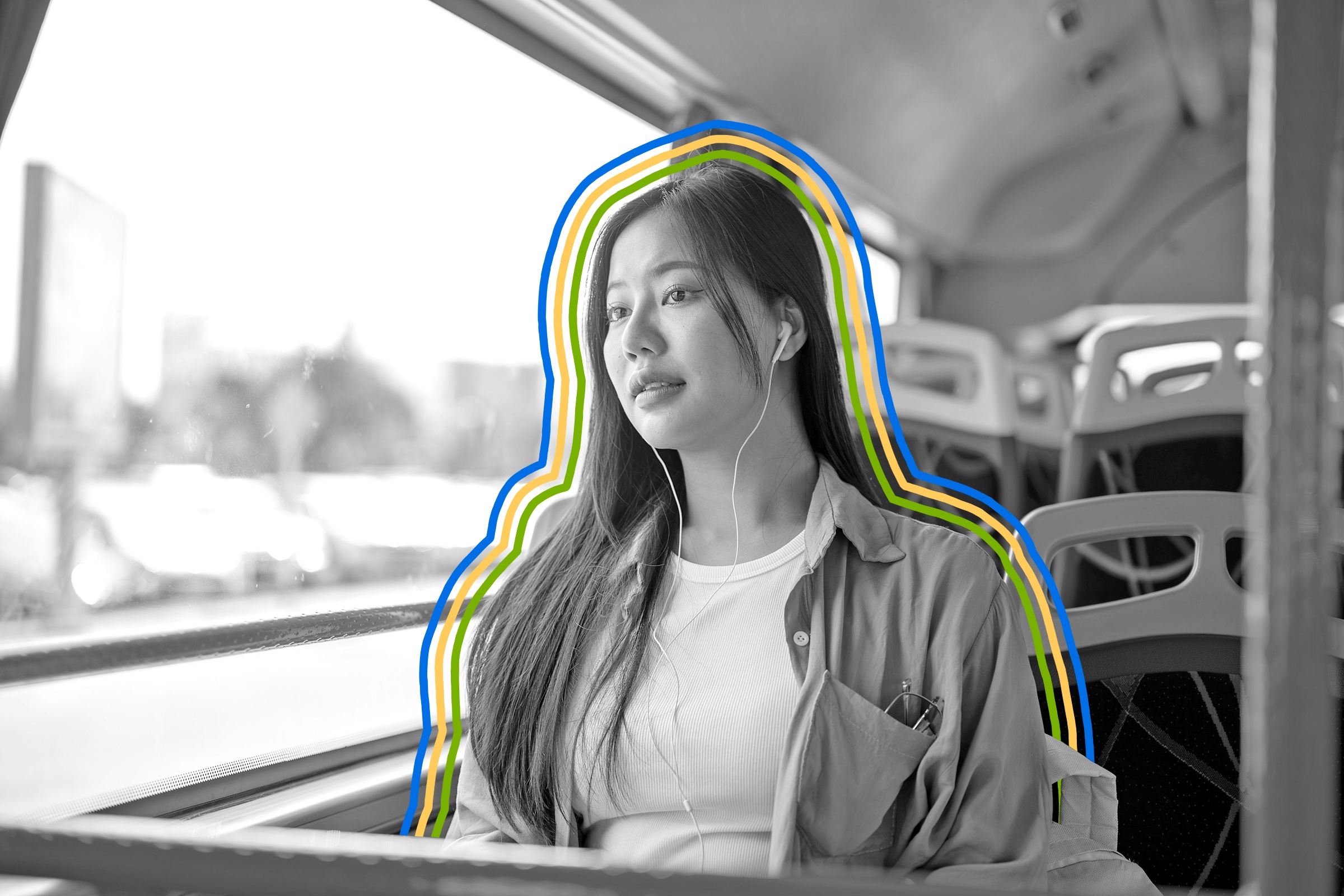 Woman riding public transit wearing earbud headphones