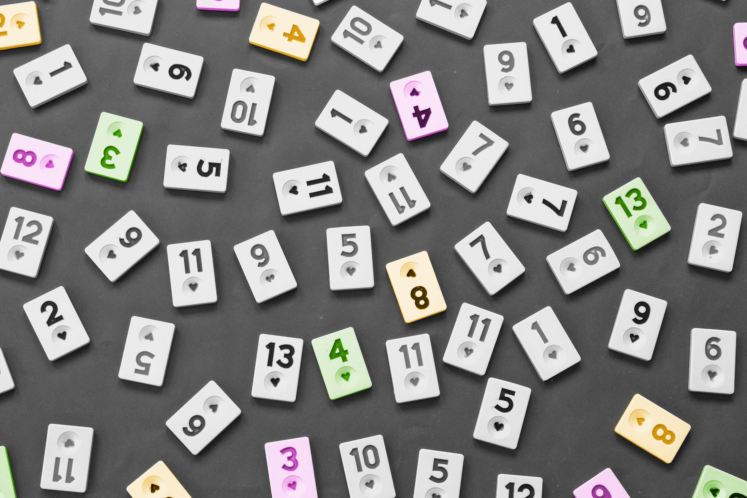 An assortment of scattered numbered tiles