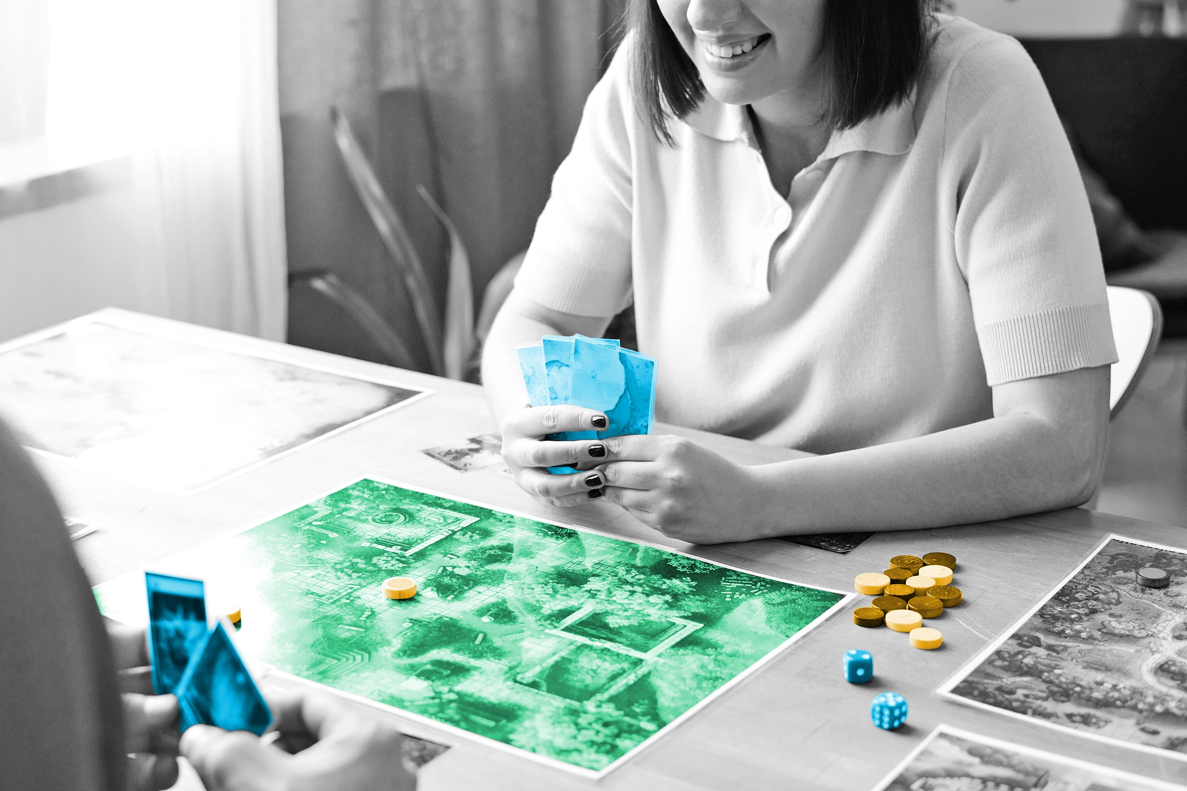 People playing board game at a table