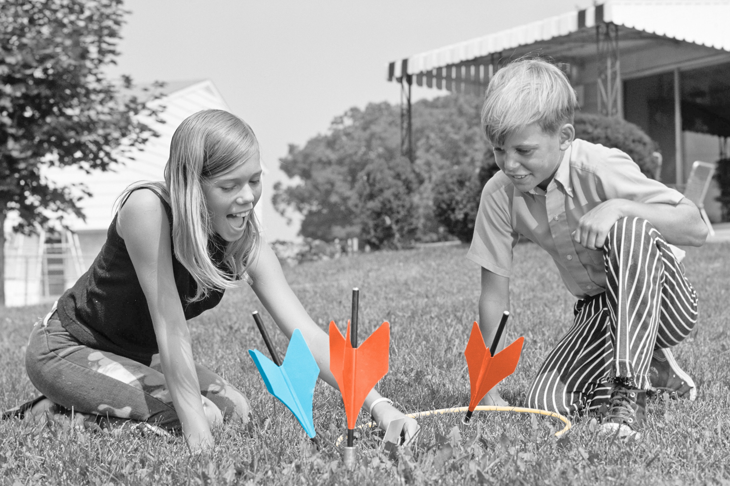 Kids playing with lawn darts