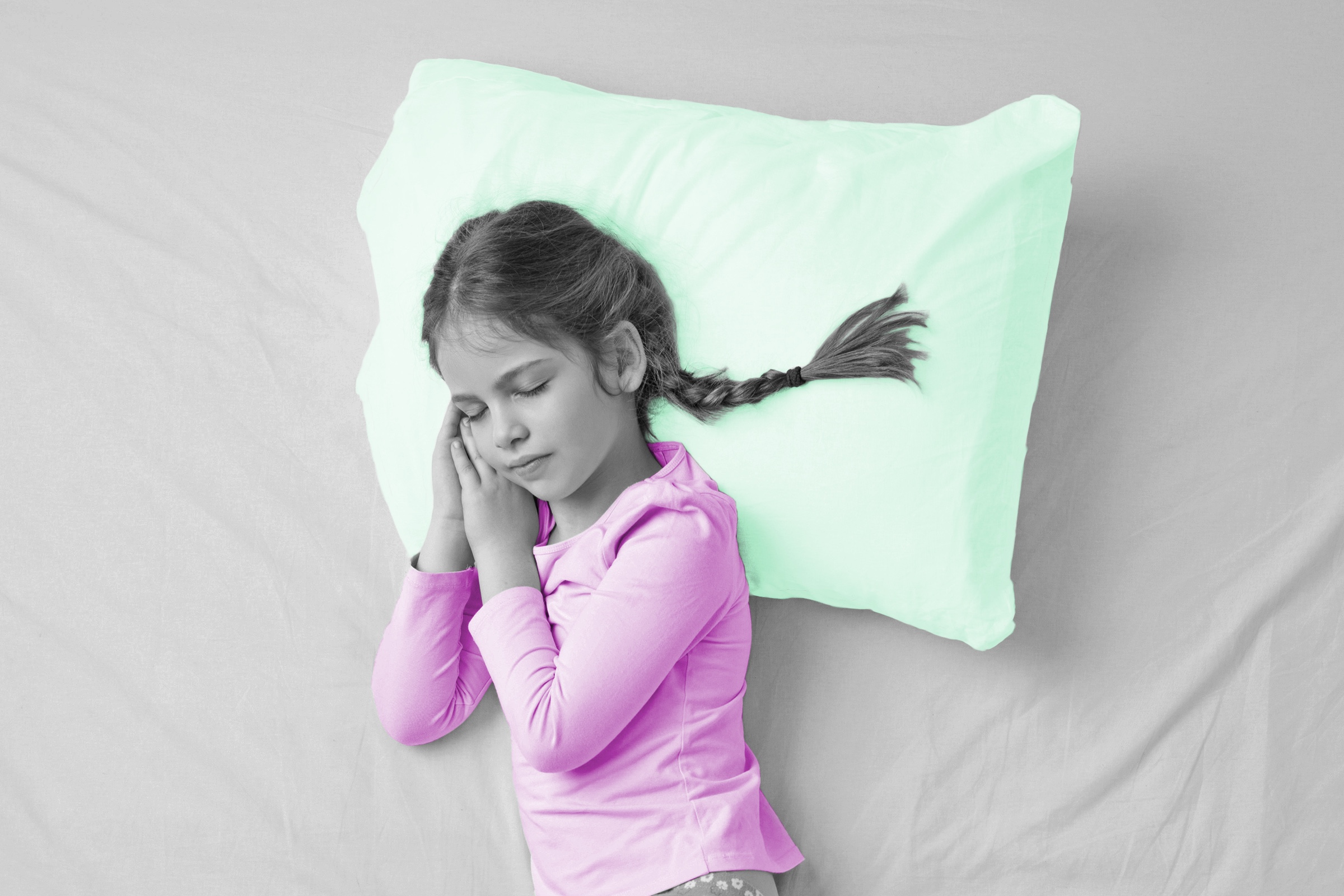 Little girl sleeping on a pillow
