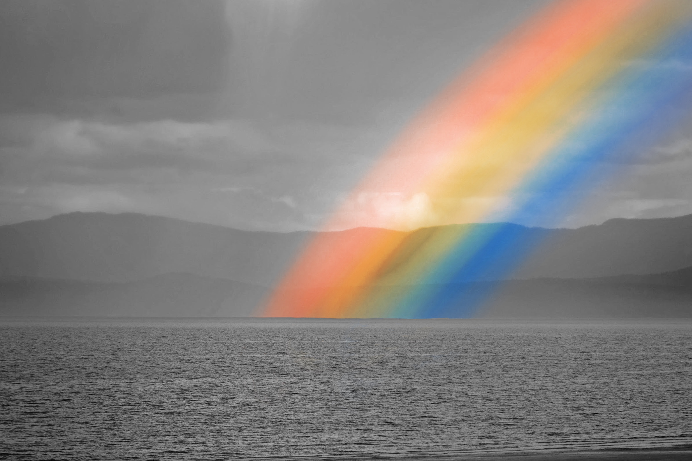Rainbow above a body of water