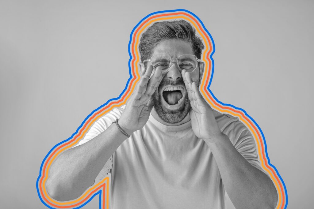 Man yelling with hands around his mouth