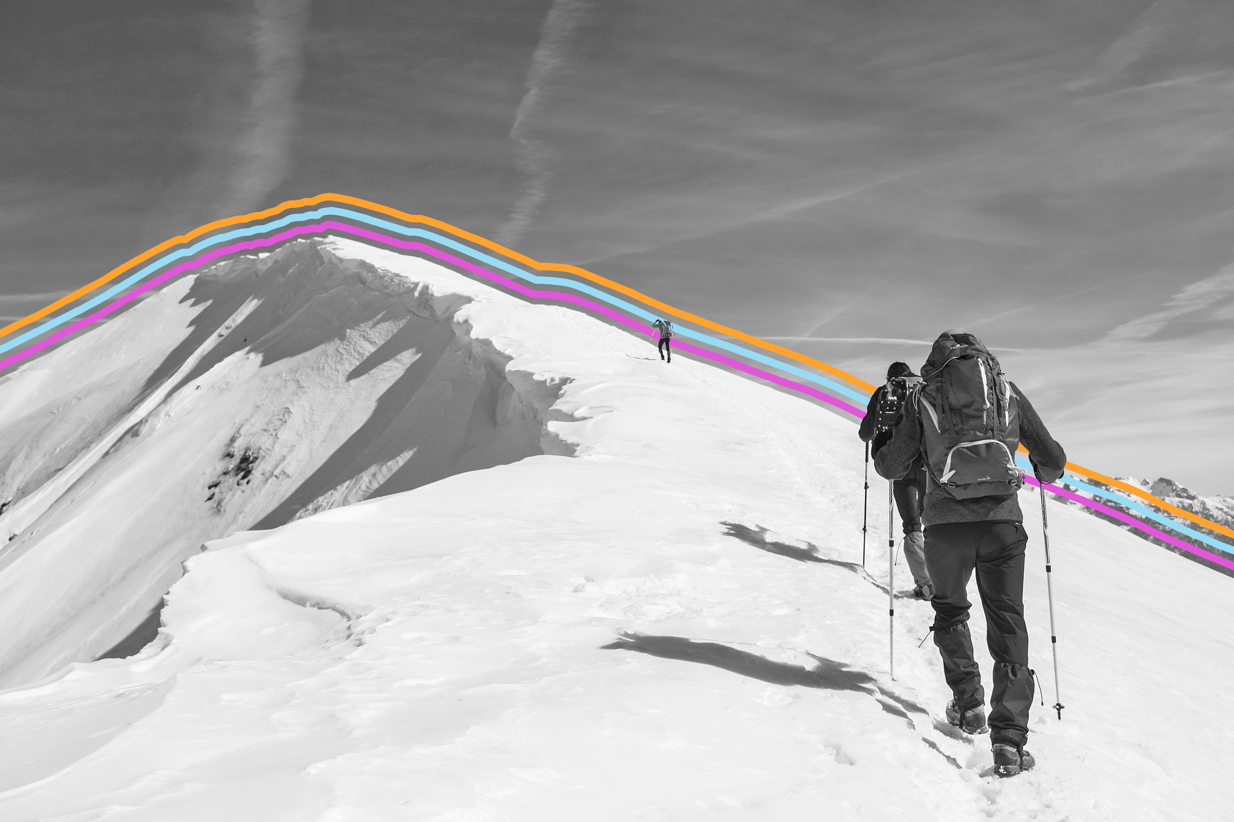 Hiker climbing the snowy peak of a mountain