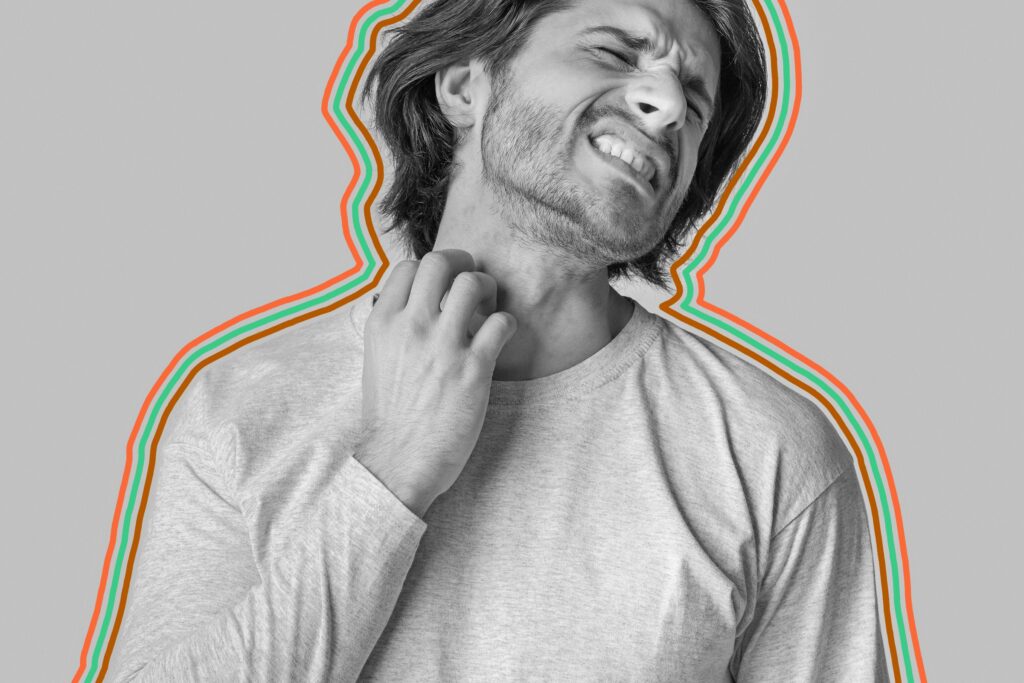 Uncomfortable man scratching at neck